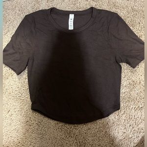 Lululemon, black T-shirt, size 4, never worn.